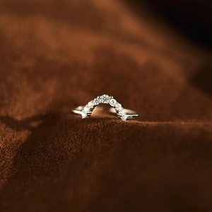 Macro view of arched S925 sterling silver ring with micro-pave cubic zirconia stones