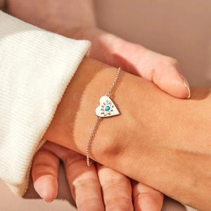 Minimalist s925 silver heart evil eye bracelet with turquoise inlay on model's wrist