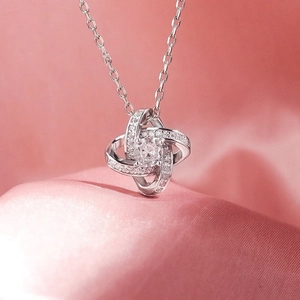 Elegant S925 sterling silver four-leaf clover eternal knot necklace with sparkling crystals