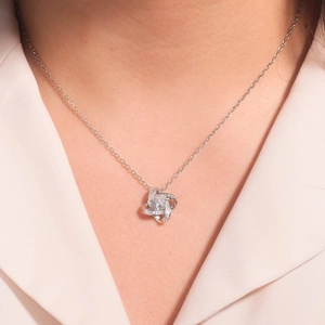 Elegant S925 sterling silver infinity knot necklace with sparkling zircon pavé on model