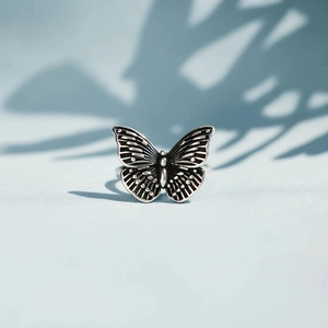 Macro shot of S925 sterling silver butterfly ring with vintage oxidized textures