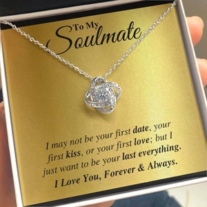 Macro shot of S925 silver eternity knot necklace with crystal pendant in a gift box