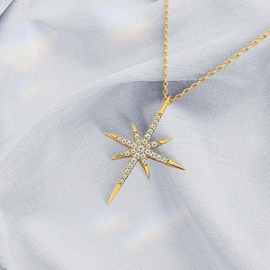 Polished gold S925 silver North Star necklace with sparkling cubic zirconia on mesh cloth