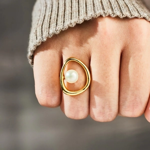 S925 silver irregular golden pearl ring worn on finger with minimalist organic design