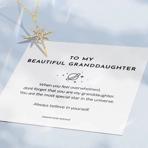 Gold North Star pendant necklace with cubic zirconia on a gift card for granddaughter
