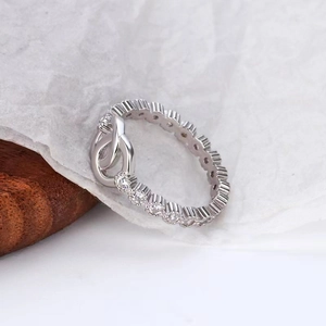 S925 sterling silver infinity ring featuring interlocking pave zircon stones on white paper