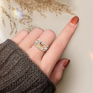 S925 sterling silver infinity ring with gold accents and sparkling cubic zirconia