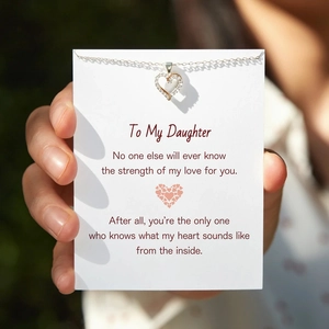 Macro shot of s925 silver heart necklace with zircons on a sentimental message card