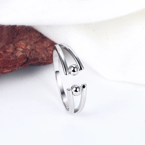 Minimalist s925 silver spinning beads open ring for women on a white textured background