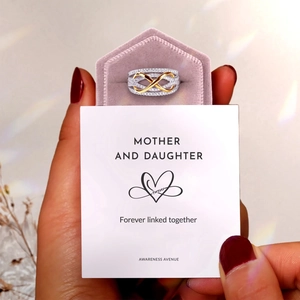 Detail of s925 silver infinity ring with gold accent and mother daughter gift card