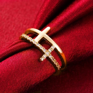 Gold s925 silver double layer cross ring with white zircon on red silk backdrop