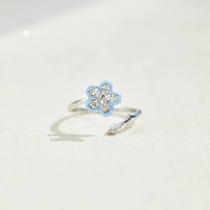 S925 sterling silver spinning ring featuring blue enamel flowers and sparkling zircons
