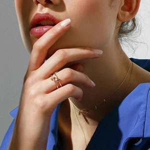 Elegant gold double layer cross ring and necklace set on model with zircon accents
