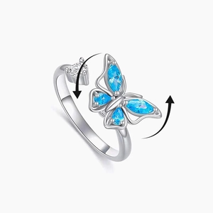 Anello rotante a farfalla antistress con zircone blu e fascia in argento regolabile