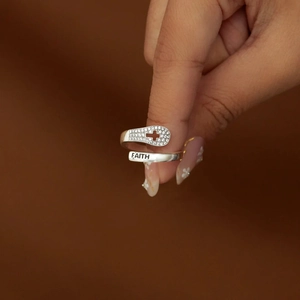 S925 sterling silver faith cross open ring with zircon stones on a brown background