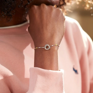 S925 sterling silver triple-ring bracelet with colorful enamel beads on a model wrist