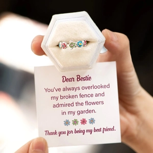 Detail of s925 silver floral enamel ring with velvet jewelry box and message card