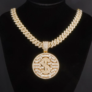 Detailed shot of iced-out gold Cuban link necklace with crystal dollar sign pendant