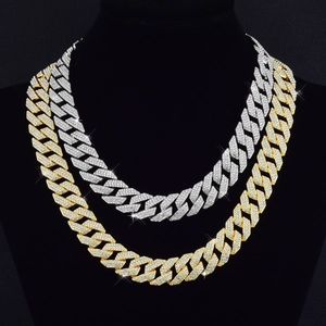 Macro shot of 14mm iced out rhombic Cuban link chain with triple rows of crystals