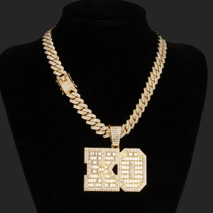 Hip hop gold Cuban chain necklace featuring a large rectangular KD letter pendant with zircons