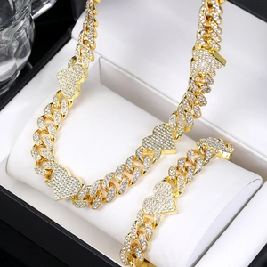 Hip hop style gold Cuban chain necklace and bracelet set with iced out heart charms