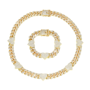 Hip hop style gold Cuban link chain set with sparkling heart charms and pavé zircon stones