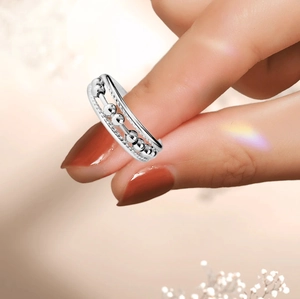 Minimalist S925 sterling silver spinning beads anxiety ring worn on finger