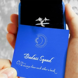 Detail of s925 silver star moon ring with zircon in a blue gift box with card