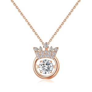 Macro detail of rose gold crown necklace featuring a sparkling dancing heart diamond