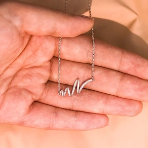 Elegant S925 sterling silver necklace with a heart-rate wave pendant and sparkling cubic zirconia