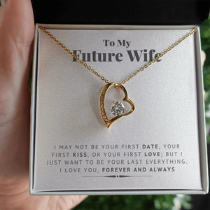 Elegant gold heart pendant necklace with zircon stones on romantic gift card and black box