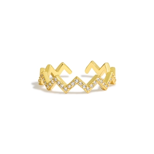 Detailed view of gold wave-shaped ring featuring sparkling cubic zirconia pave setting