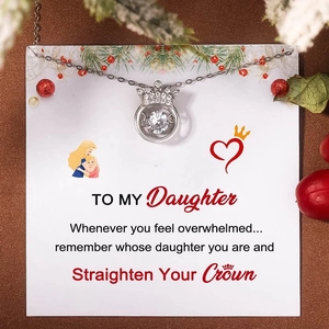 Macro view of S925 sterling silver crown necklace with shimmering heart-shaped gift card