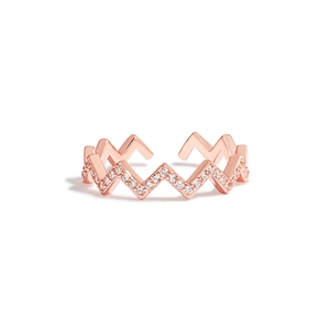 Detail of rose gold wavy ring featuring sparkling pavé set zircons and adjustable band
