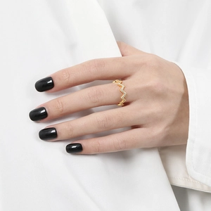 Elegant gold S925 sterling silver wavy ring featuring sparkling white cubic zirconia stones