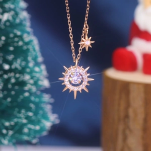 Elegant s925 silver sun star necklace in rose gold displayed on a festive background