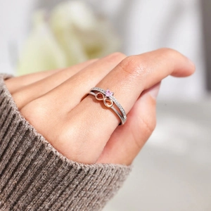 S925 sterling silver infinity heart ring with pink gemstone and rose gold accents