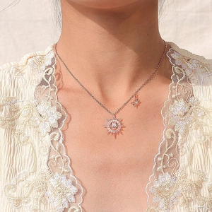 Elegant S925 rose gold star necklace featuring a sparkling sun pendant on a female model