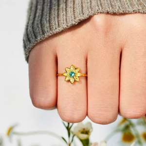 Elegant s925 silver sunflower ring with blue center stone and yellow drop petals on hand