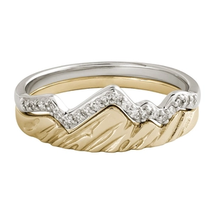 Detailed view of layered S925 silver and gold mountain rings with cubic zirconia