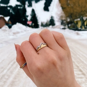 Detail of s925 silver double-layer mountain ring with pavé zircons worn in snow