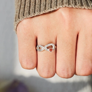 Minimalist S925 silver infinity ring with sparkling white zircons and a small red heart