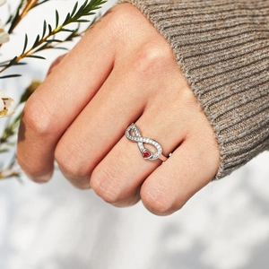 Elegant s925 silver infinity ring with red heart gemstone and white zircon accents