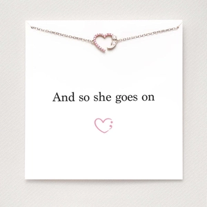 S925 sterling silver heart semicolon necklace with pink zircon on display card