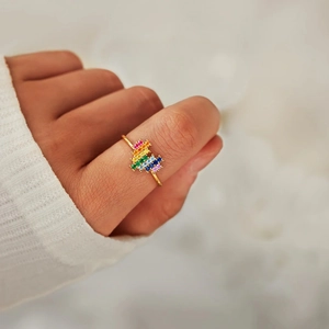 Minimalist s925 silver gold ring with rainbow zircon stones worn by a model