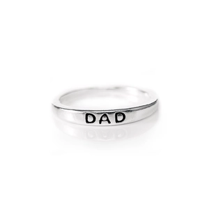 Minimalist S925 sterling silver ring with black DAD engraving on a clean white background