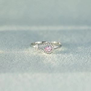 Polished S925 sterling silver ring featuring a pear-cut pink gemstone and zircon halo