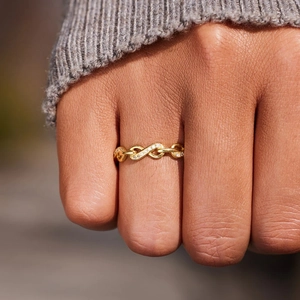 Elegant gold infinity link ring for women featuring sparkling zircon pavé setting