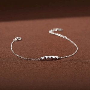 Elegant S925 sterling silver heart bracelet with white zircon pavé on textured fabric