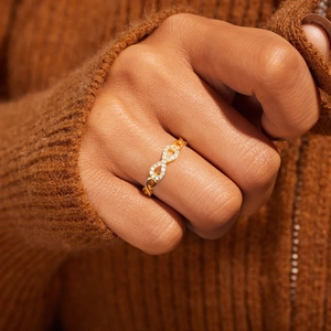 Elegant gold infinity ring for women featuring micro-paved zircons on a slender band